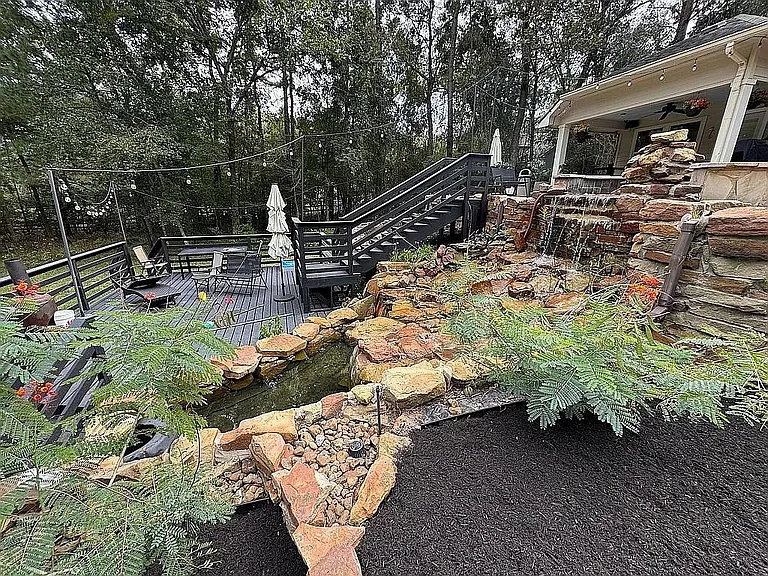 Large open yard at 27103 Bridleway Cir Magnolia TX on 8.48 acres