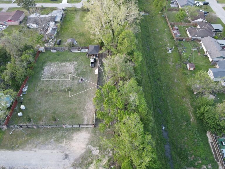 Aerial listing photograph with an arrow pointing to the 0 Tillison Street land offering in Houston, Texas