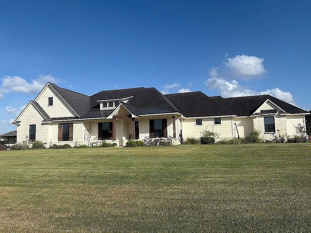Front exterior and covered porch at 1143 Angus Trail in Angleton, Texas