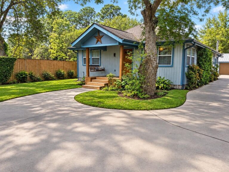 Front exterior and driveway at 11608 Old Main Street Loop Road in Houston, Texas