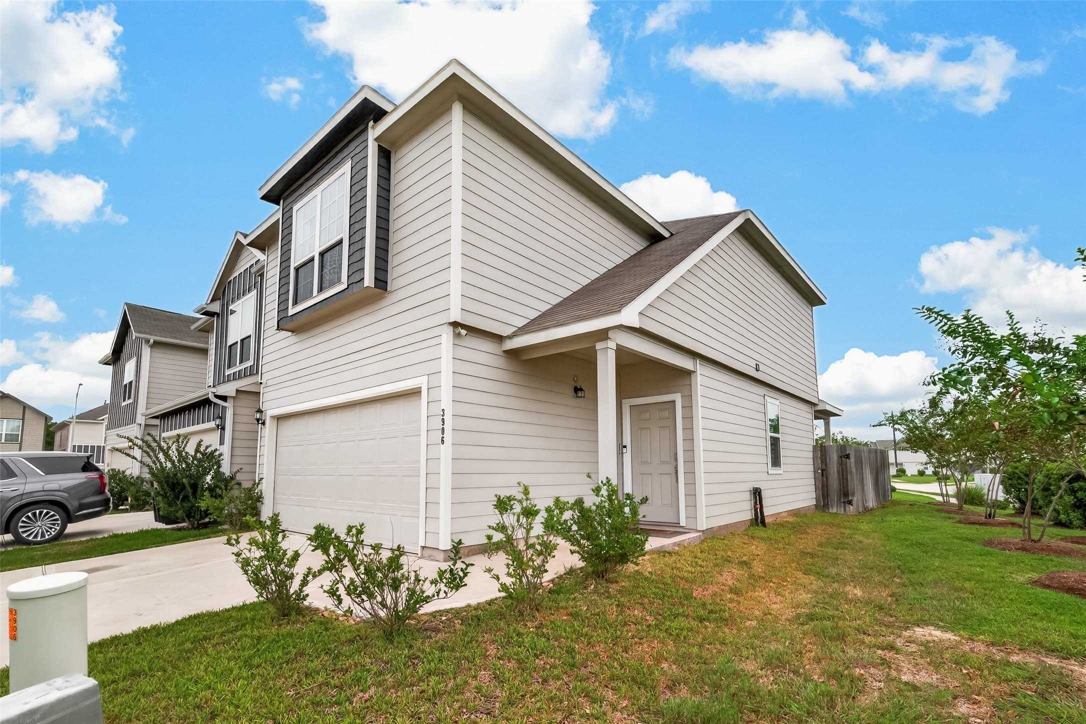 Front exterior and two-car garage at 3906 Arslan Drive in Katy, Texas