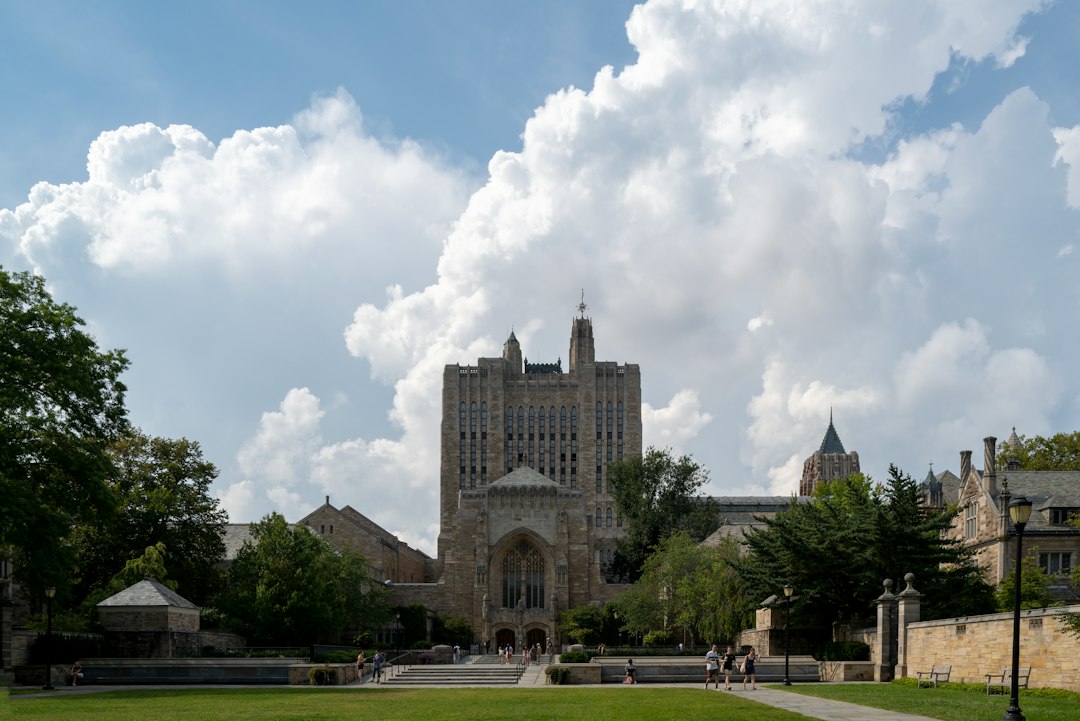 A large building sitting on top of a lush green field