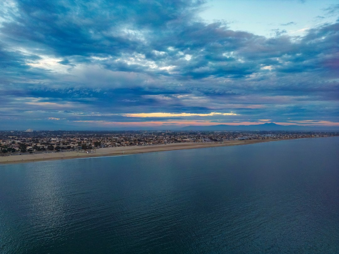 Coastal town with dramatic clouds over the ocean